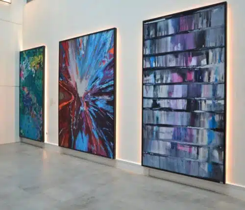 Acoustic Art Panels three panels shown side by side on a large wall