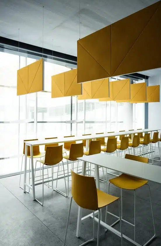 Acoustic Panels Diamante panels suspended from the ceiling above tables in a breakout space
