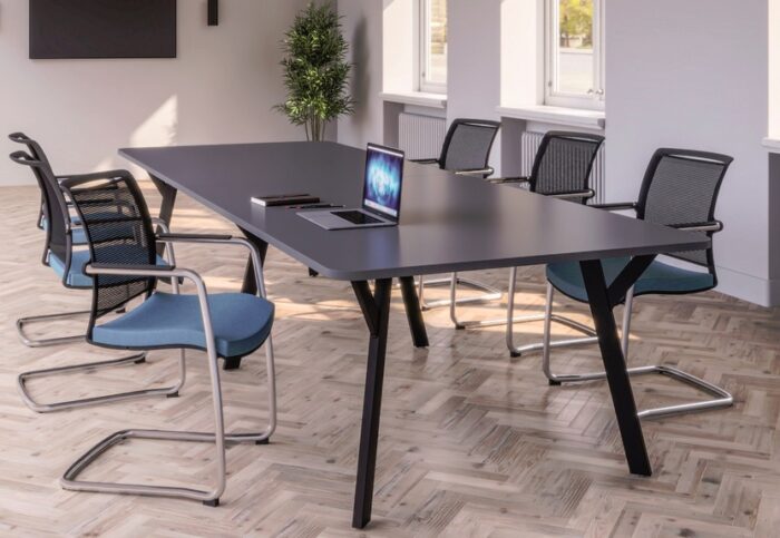 Boardroom Tables with a black shaped rectangular top and Y leg frame shown in a meeting room