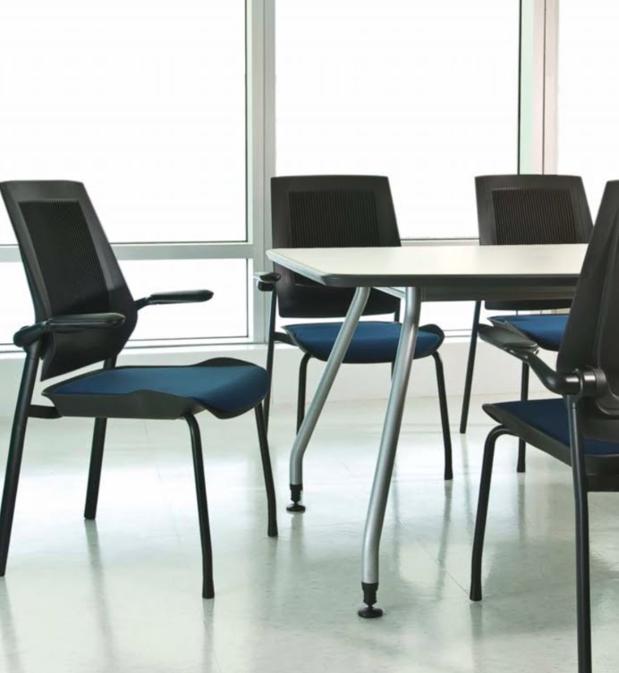Bodyflex Visitor Chair group of 4 leg chairs with blue seatpads around a meeitng table