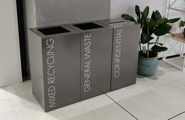 CZ Bins shown in a row of three for recycling general waste and confidential waste