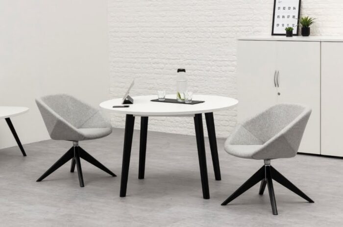 Clara Soft Seating two chairs with wooden pyramid base in black stain shown with a matching round table