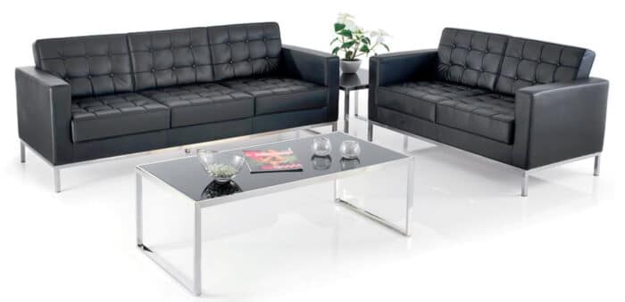 Classico Reception Seating two and three seater sofas with black leather and chrome legs shown with a glass top coffee table