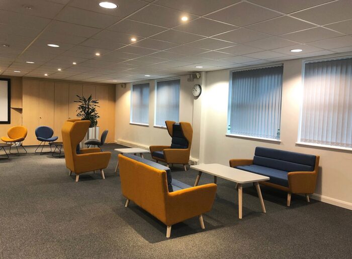 Douglas Soft Seating low back sofas and high back wing chairs in a breakout space