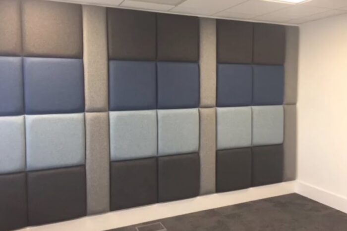 Eden Acoustic Tiles rectangular tiles covening an entire wall, upholstered in blues and grey