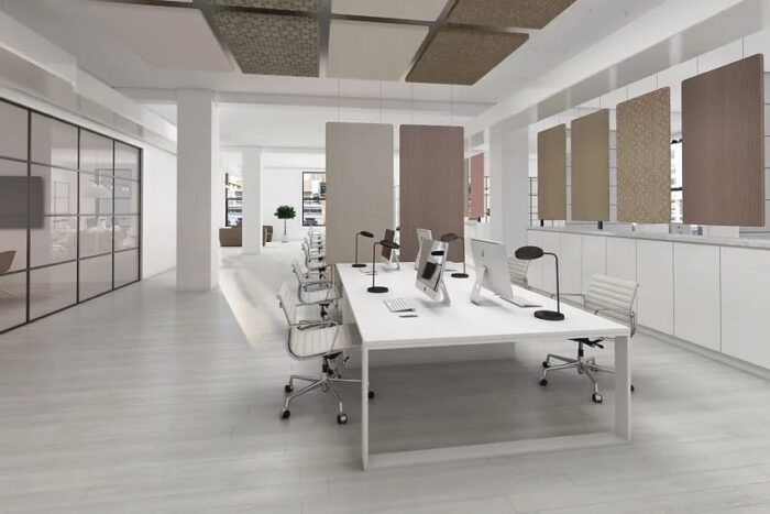 Eden Acoustic Tiles rectangular tiles wall and ceiling mounted around a bench desk in an open plan office