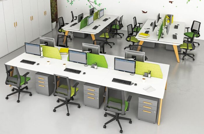 Evolution Bench one 6 person and two 4 person configurations with white desktops, pedestals and green screens