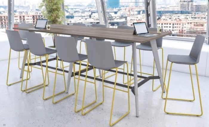 Evolve Colours Breakout Tables 10 seater poseur table shown with high stools in a meeting space