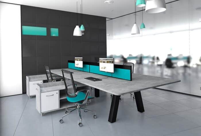Force Bench Desk with black frame and concrete effect top shown in a meeting room