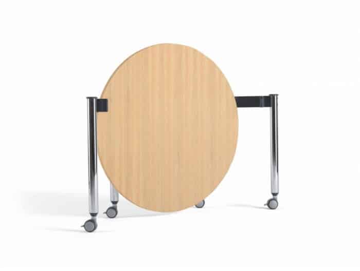FourKonnect Meet Anywhere Tables shown folded, with a beech finish top and chrome straight legs on castors
