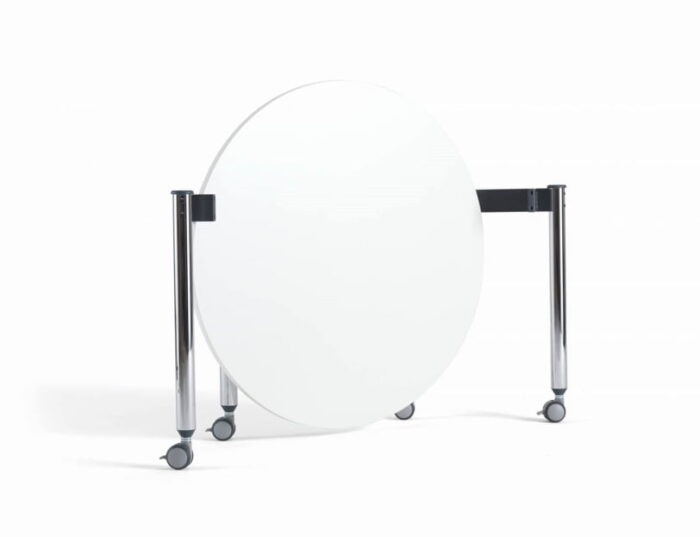 FourKonnect Meet Anywhere Tables shown folded, with a white top and chrome straight legs on castors