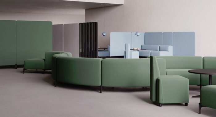 FourPeople Modular Seating curved units shown in an open plan office shown with tall panels and booths