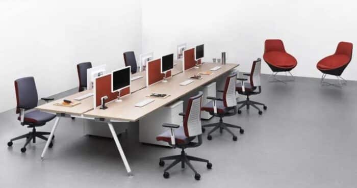 Freeflex Task Chair six chairs with height adjustable arms with a bench desk and desk screens