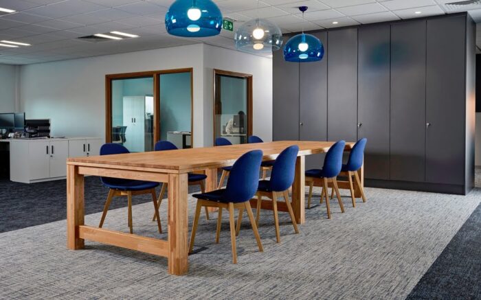 GD10 Dining Tables 8 seat table with six legs in an office space