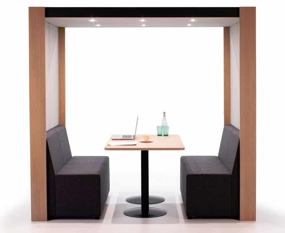 Harbour Office Pods front view of a four seater with an open front and back, pillar base table and spotlights
