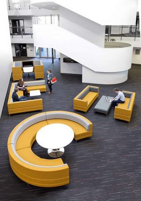 Henray Soft Seating low back, high back and curved units upholstered in yellow and grey, in a workspace