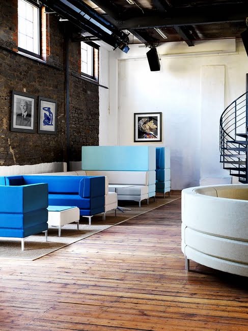 Henray Soft Seating low back, high back and units upholstered in blue fabric shown near a curved low back configuration