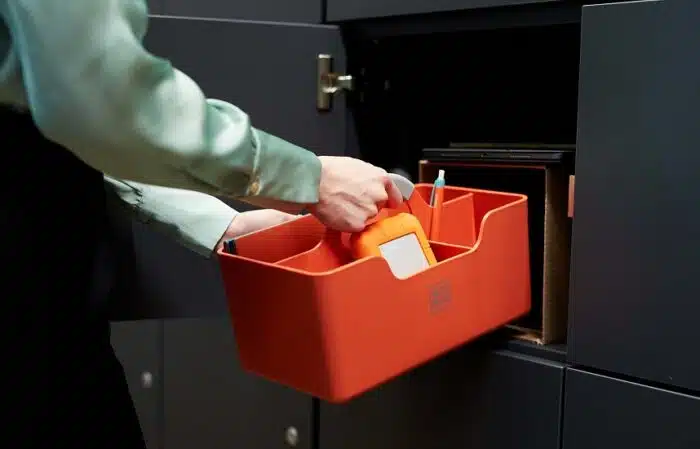 Hotbox 1 in orange shown being placed inside a locker