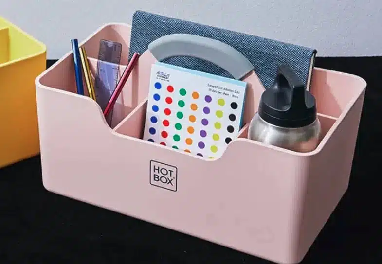 Hotbox 1 in pink shown with stationery and notebook inside