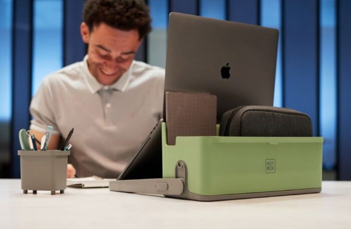 Hotbox 4 in green, shown on a desktop with tablet and pencil holder