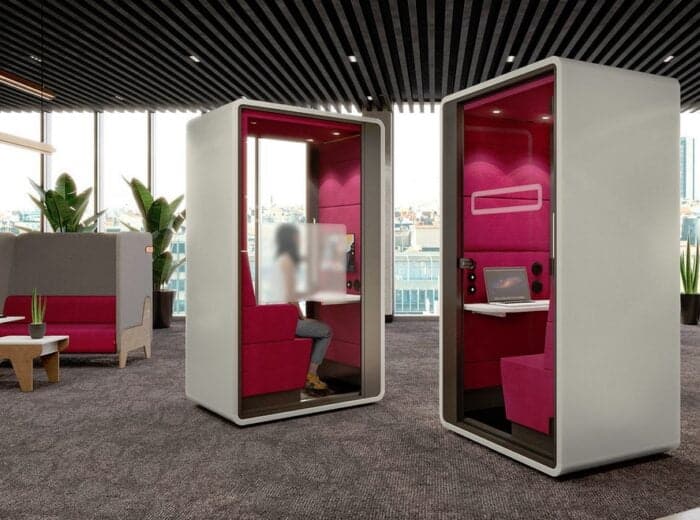 HushHybrid Pod two booths shown in a breakout space, one booth has part frosted glass for more privacy