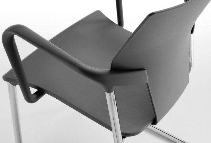 Ikon Chair close up of seat shell with fixed arms and cantilever frame