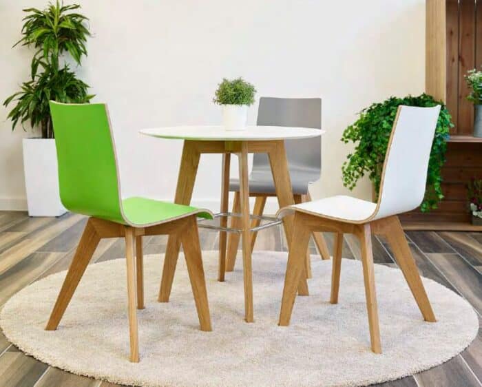 Jinx Table dining height with white swerve laminate top and 4 leg natural oak frame shown with 3 Jinx dining chairs