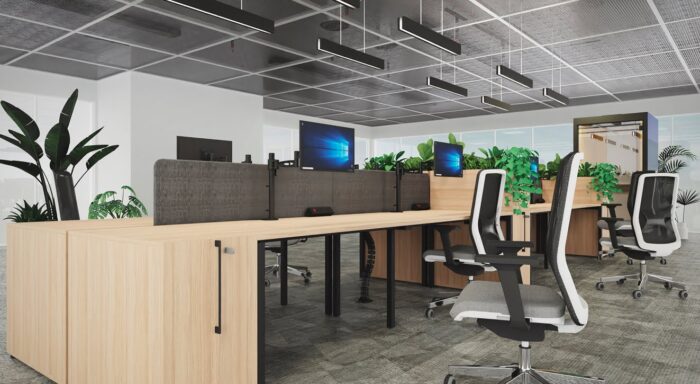 Kardo Monitor Arm single screen arms in black shown mounted to a bank of bench desks with task chairs in an office space