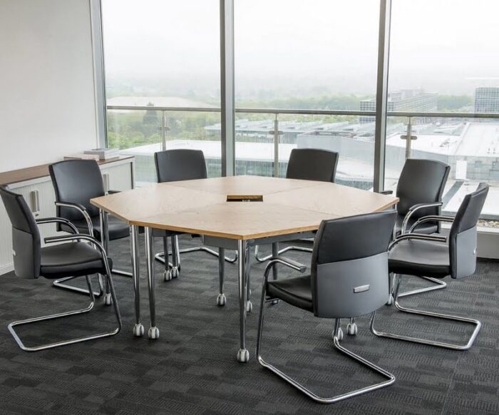 Kite Folding Tables 4 tables in a square formation with tapered legs in a meeting room