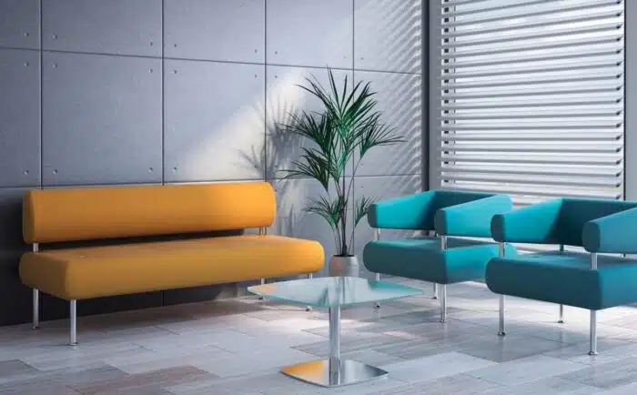 Koko Soft Seating three seat bench and two single seat armchairs shown with a coffee table in a reception area