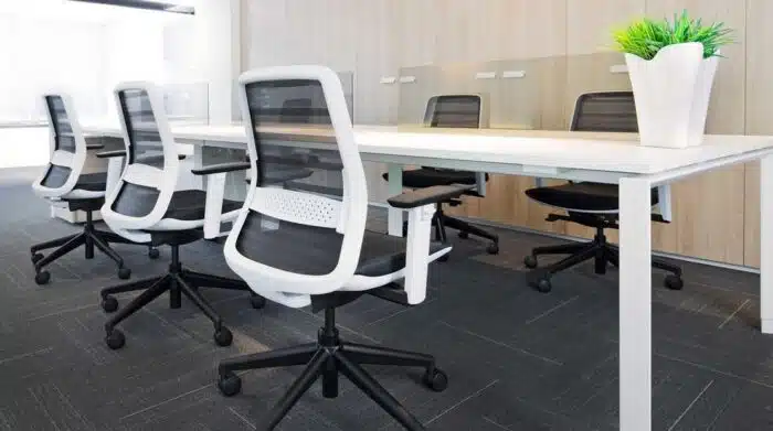 Koplus Tonique Task Chair six chairs in white with black frames around a bench desk