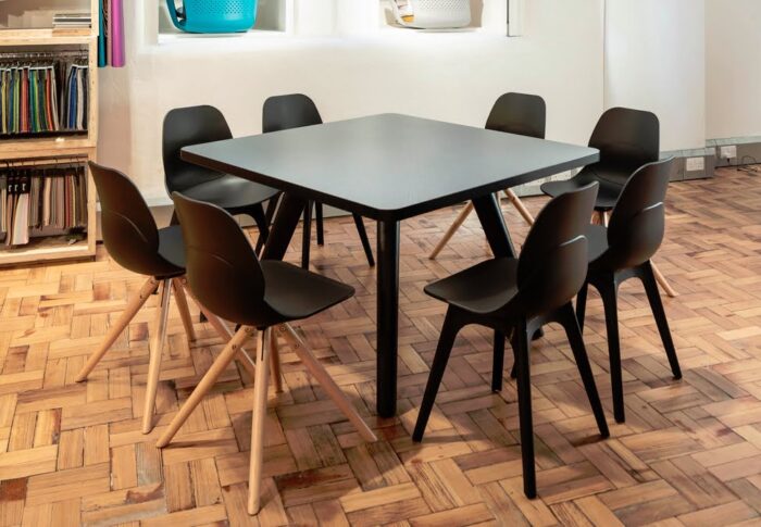 LG4 Plastic Seating group of 4 leg plastic frame chairs shown with 4 LG4 wood leg chairs in a breakout space
