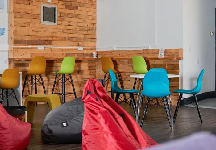 LG4 Wood Seating several diner height and poseur height chairs with large bean bags in a breakout space