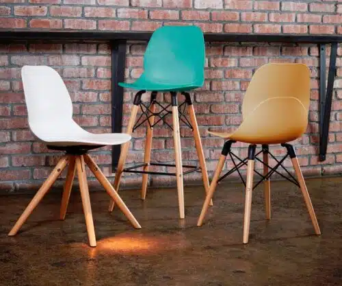 LG4 Wood Seating two diner height chairs and one poseur height chair by a brick wall