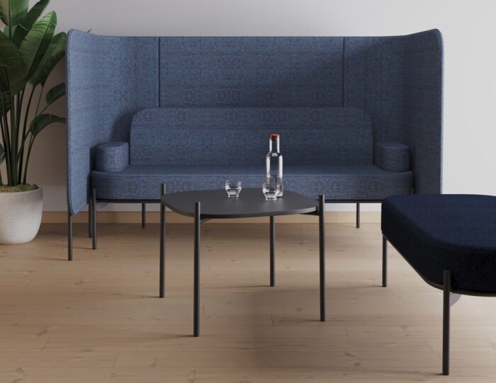 Leaf Pods high back sofa pod with blue upholstery with a table and pouffe unit