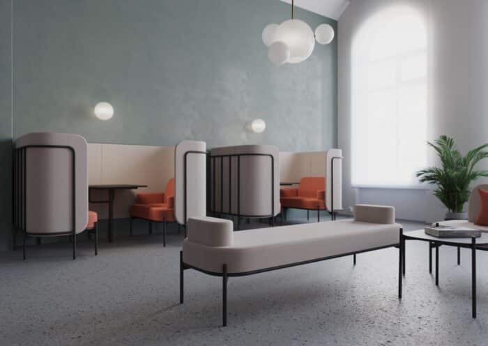 Leaf Pods two chat pods side by side in a breakout space along with a coffee table and a free standing backless sofa