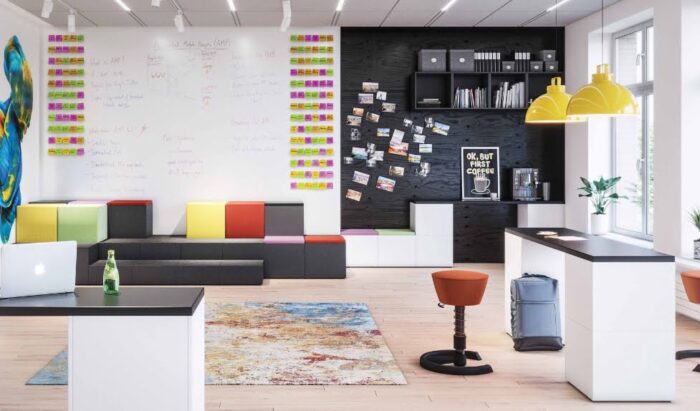 Ligo Modular Seating And Tables 2 tier seating and two desk arrangement shown in a work space