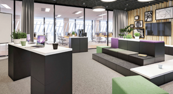 Ligo Modular Seating And Tables 3 tiered seating and single tier low level seating and desk arrangement in shown in a meeting work space