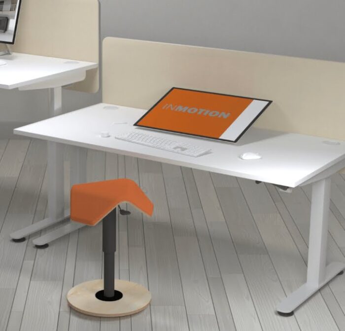 Liiku Joy Stool shown in front of a sit stand desk