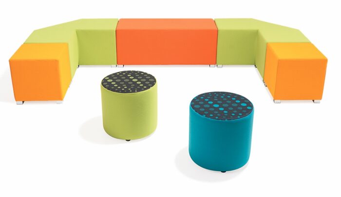 Link Breakout Seating cube, bench and tangent modules placed in a row to form a long seating unit with two radius modules in front