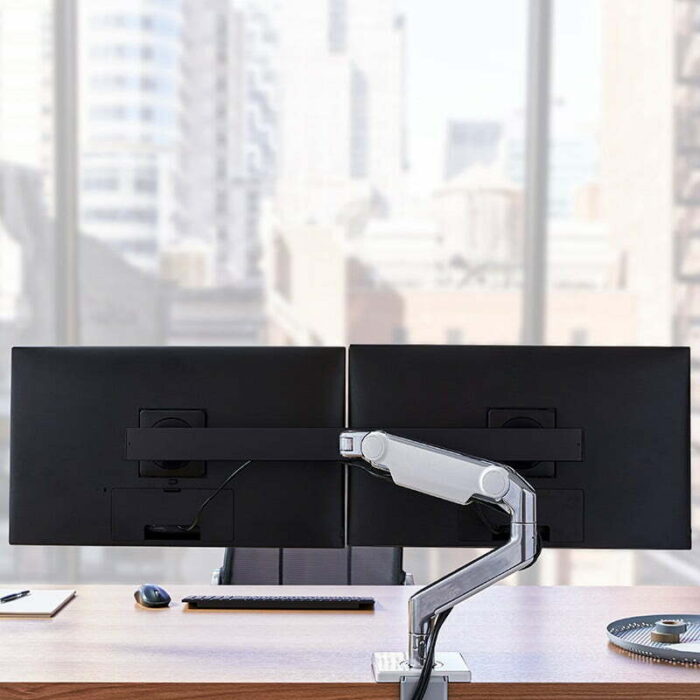 M8.1 Monitor Arm With Crossbar mounted on a desk
