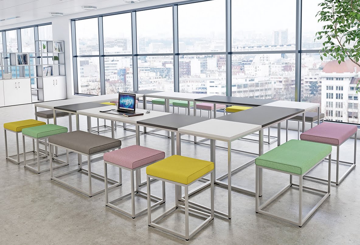Matrix Tables And Seating rectangular and square tables in a rectangle configuration with square and rectangular seating and seat pads shown in an office space