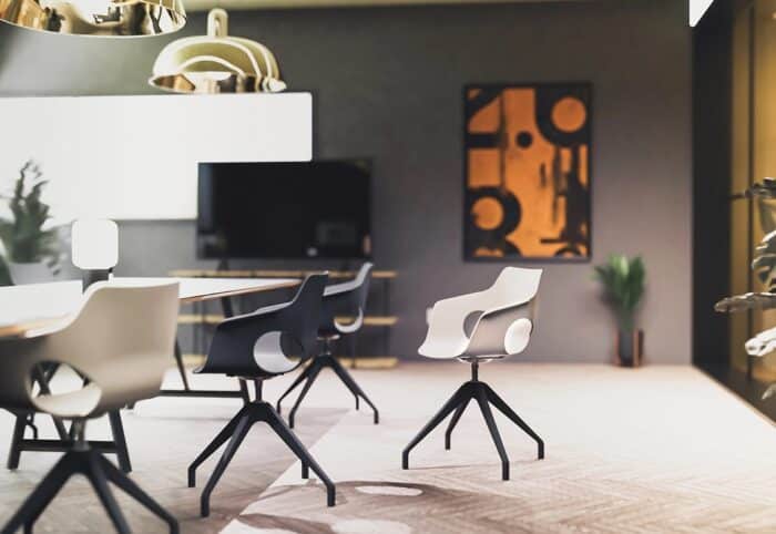 Ora Chair group of chairs with polypropylene shells and 4 star swivel bases shown around a table in a meeting room