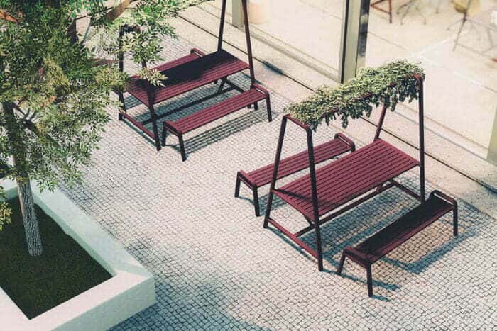 Osti Cloud Table two 1200x800 with Osti bench seats and hanging plants in an outside area