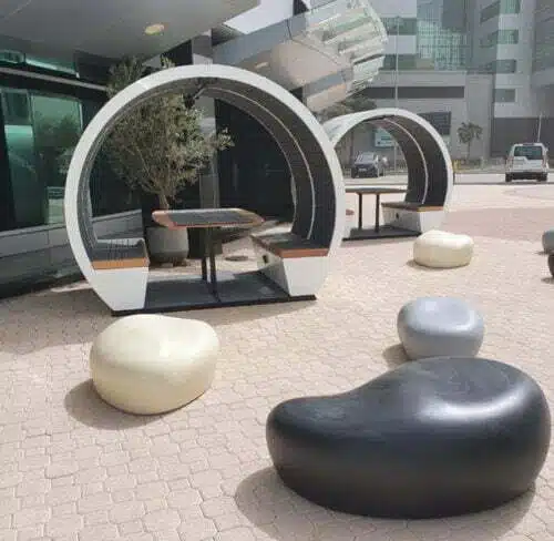Outdoor Meeting Pods For KSA showing two four person pods outside the reception of an office building