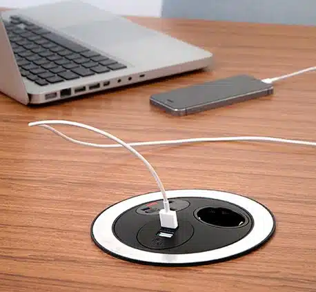 Pandora Power Module black unit with stainless steel inlay shown on a desktop