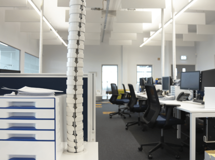 Pathfinder Cable Management desk to ceiling umbilicals shown in an office setting