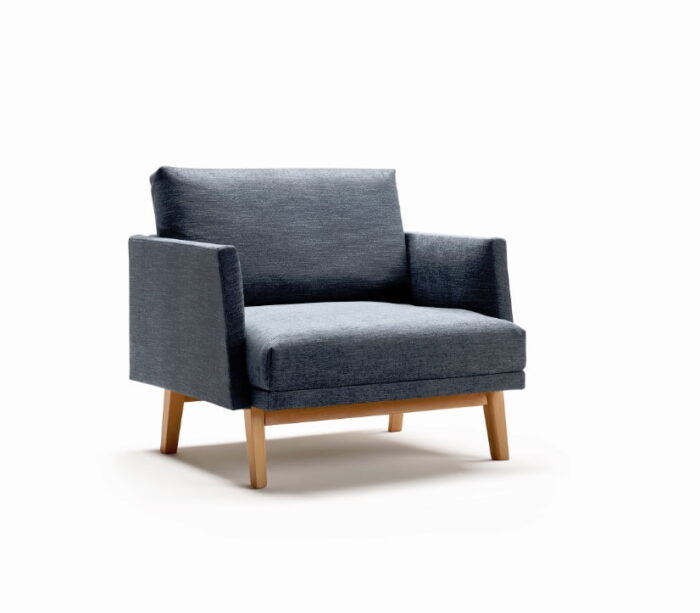 Pausa Modular Seating armchair with upholstered trim and blue upholstery