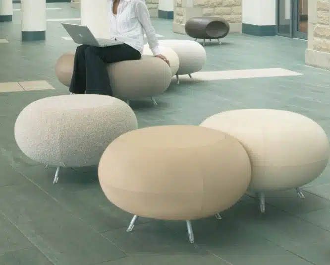 Pebble Stool group of 5 stools in neutral coloured fabric shown in a reception area