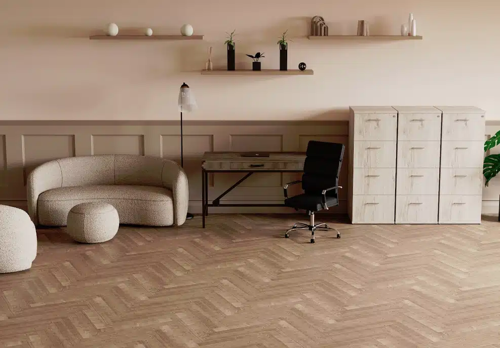 Phoebe Soft Seating - Phoebe sofa, swivel chair and footstool shown next to a desk and locker unit in a workspace